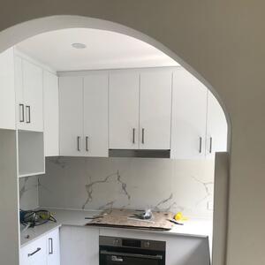 Check out this kitchen!!

This coastal kitchen in Palm Beach is tucked in an arch nook.
